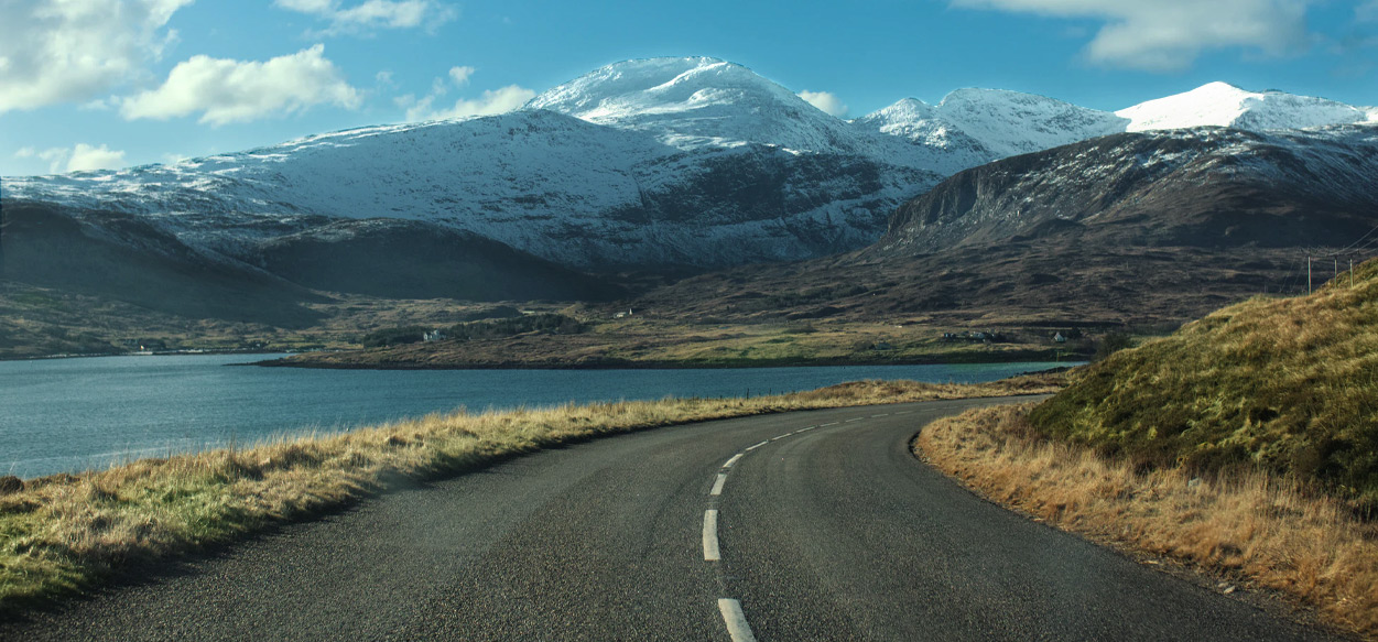 Coastal road with mountains