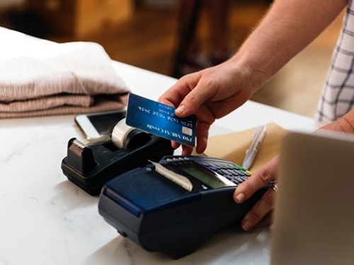 person completing purchase using credit card